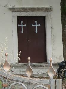 Church door with orthodox cross near Kremena